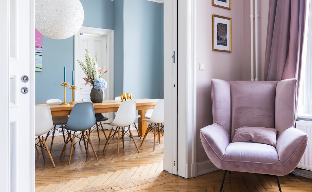 A stylish dining room with a solid wood table in an old building.